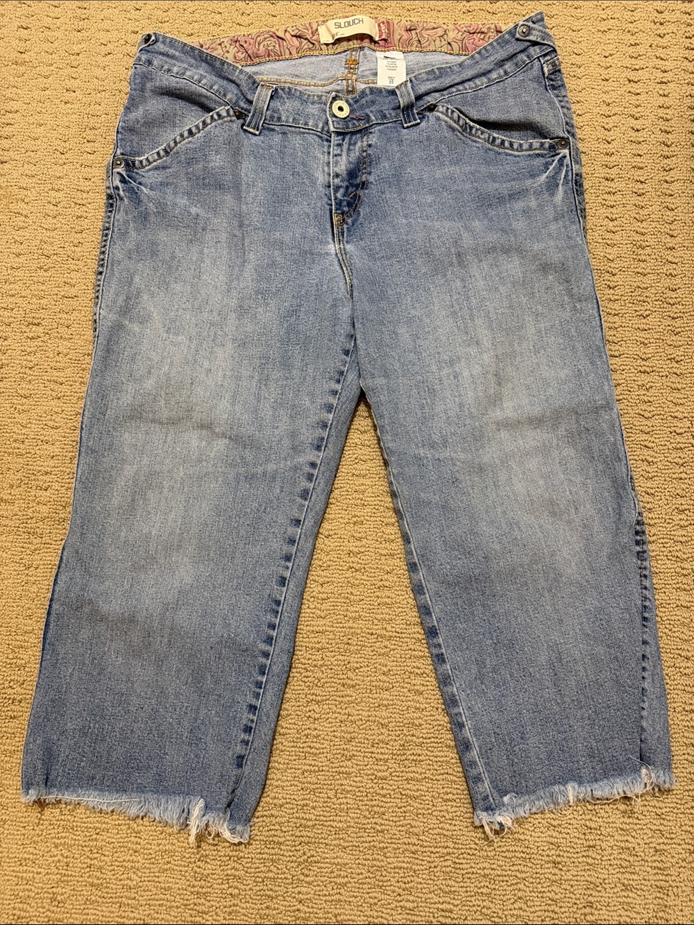 Woman’s Levi's 504 Light Blue Cropped Slouch Jeans with Frayed Hem, Size 20.